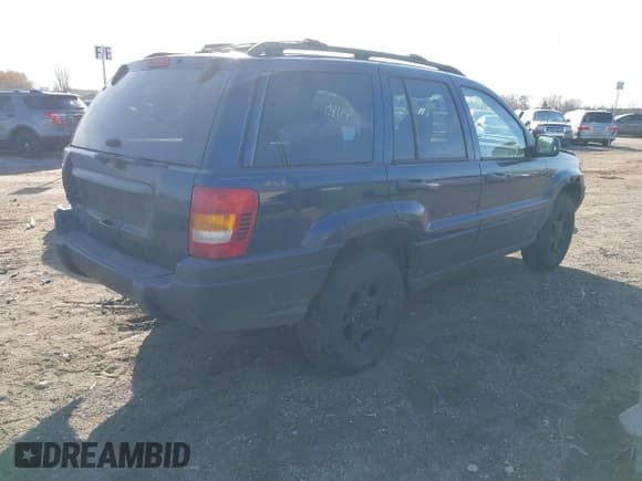 ✅ 2001 Jeep Grand Cherokee Laredo • VIN: 1J4GW48S01C699585 • Lot: 43744180. Listed on IAAI with 219,402 mi. Free auction sales archive from the USA and detailed vehicle history report at DreamBid. Image 4.