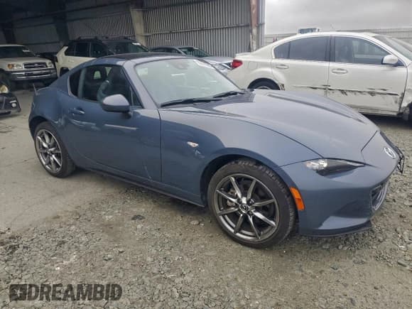 ✅ 2021 Mazda MX-5 Miata Grand Touring • VIN: JM1NDAM75M0461451 • Lot: 96091305. Listed on Copart with 23,474 mi. Free auction sales archive from the USA and detailed vehicle history report at DreamBid. Image 4.