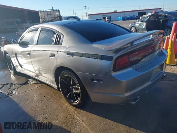 2014 Dodge Charger SXT with VIN 2C3CDXHG2EH239214, listed as a IAAI auction lot 43595966 with 219,931 mi miles and . Bid and sale history available at DreamBid. Image 3.