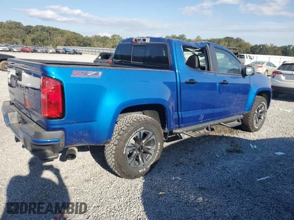 ✅ 2022 Chevrolet Colorado 4WD Z71 • VIN: 1GCGTDENXN1147977 • Лот: 75995264. Опубликован ранее на Copart с пробегом 26 184 миль. Бесплатный доступ к архиву аукционных продаж из США и подробный отчёт об истории автомобиля на DreamBid. Изображение 3.