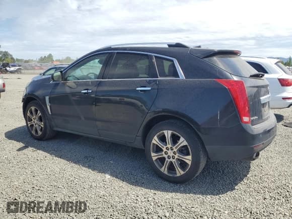 ✅ 2012 Cadillac SRX Performance Collection • VIN: 3GYFNEE39CS626584 • Lot: 55050825. Listed on Copart with 165,114 mi. Free auction sales archive from the USA and detailed vehicle history report at DreamBid. Image 2.
