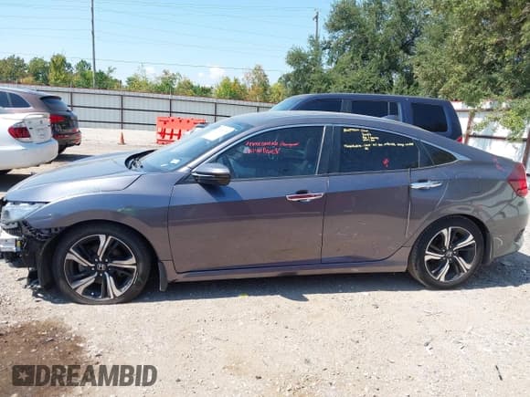 ✅ 2016 Honda Civic Touring • VIN: 19XFC1F90GE031070 • Lot: 43318105. Listed on IAAI with 55,853 mi. Free auction sales archive from the USA and detailed vehicle history report at DreamBid. Image 15.