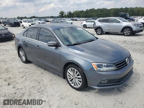 ✅ 2015 Volkswagen Jetta SE • VIN: 3VWD07AJ8FM318503 • Lot: 82072295. Listed on Copart with 77,037 mi. Free auction sales archive from the USA and detailed vehicle history report at DreamBid. Image 4.