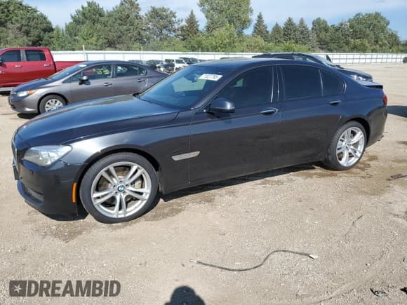 ✅ 2014 BMW 7 Series 750i xDrive • VIN: WBAYB6C54ED224456 • Lot: 71027795. Listed on Copart with 104,442 mi. Free auction sales archive from the USA and detailed vehicle history report at DreamBid. Image 1.