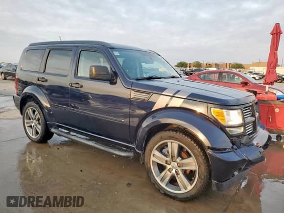 2011 Dodge Nitro Shock with VIN 1D4PT7GX9BW576481, listed as a Copart auction lot 49848955 with 156,015 mi miles and Salvage title. Bid and sale history available at DreamBid. Image 4.