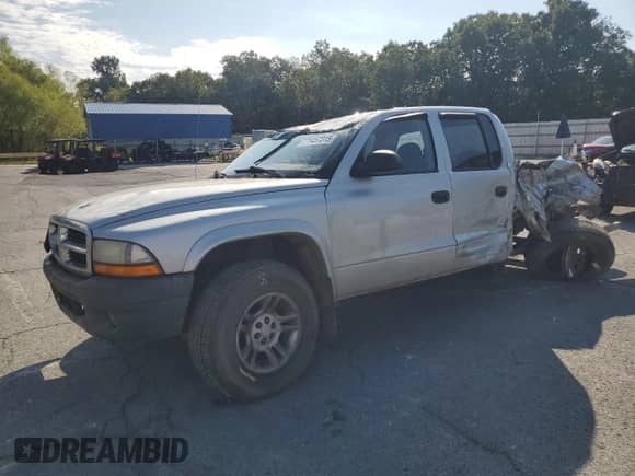 2004 Dodge Dakota Sport с VIN 1D7HG38N34S770063, выставлен на аукционе Copart как лот 71457315 с пробегом 320 703 миль миль и Списание • Salvage title. История ставок и продаж доступна на DreamBid. Изображение 1.