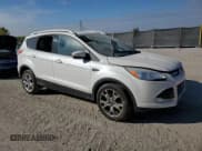 ✅ 2014 Ford Escape Titanium • VIN: 1FMCU0JX9EUA28520 • Лот: 82393815. Опубликован ранее на Copart с пробегом 136 413 миль. Бесплатный доступ к архиву аукционных продаж из США и подробный отчёт об истории автомобиля на DreamBid. Изображение 4.