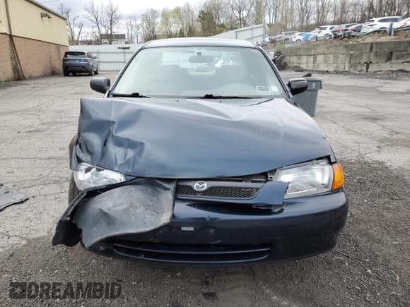 ✅ 1998 Mazda Protege DX • VIN: JM1BC1411W0238344 • Lot: 63596295. Listed on Copart with 74,052 mi. Free auction sales archive from the USA and detailed vehicle history report at DreamBid. Image 5.