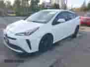 2021 Toyota Prius L Eco with VIN JTDKAMFU9M3131228, listed as a IAAI auction lot 41257117 with 72,840 mi miles and . Bid and sale history available at DreamBid. Image 2.