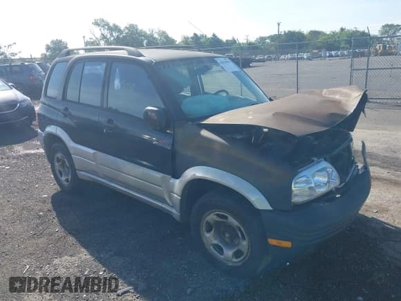 ✅ 1999 Suzuki Grand Vitara JLX • VIN: JS3TD62V2X4120349 • Lot: 42819058. Wystawiony na IAAI z przebiegiem 320 149 mil. Bezpłatny archiwum sprzedaży aukcyjnych z USA i szczegółowy raport historii pojazdu na DreamBid. Zdjęcie 1.