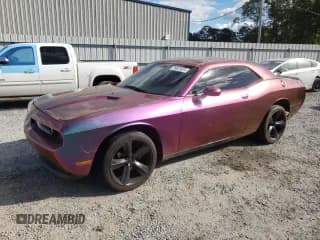 ✅ 2012 Dodge Challenger SXT • VIN: 2C3CDYAG1CH213250 • Lot: 76621624. Wystawiony na Copart z przebiegiem 174 297 mil. Bezpłatny archiwum sprzedaży aukcyjnych z USA i szczegółowy raport historii pojazdu na DreamBid. Zdjęcie 1.
