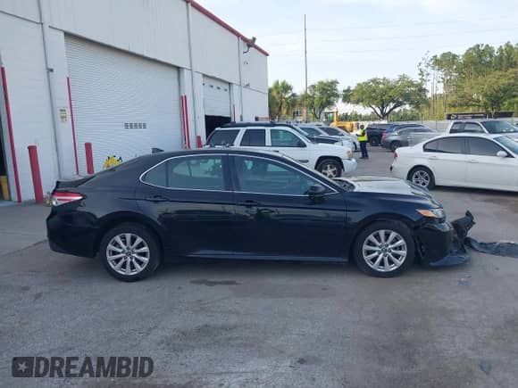 2019 Toyota Camry LE z VIN 4T1B11HK7KU258086, wystawiony jako IAAI lot #42436658 z przebiegiem 130 729 mil mil oraz . Historia ofert i sprzedaży dostępna na DreamBid. Obrazek 13.