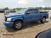 2006 Dodge Dakota SLT z VIN 1D7HW48N56S706814, wystawiony jako Copart lot #64657204 z przebiegiem 120 221 mil mil oraz Nie do naprawy • Non repairable. Historia ofert i sprzedaży dostępna na DreamBid. Obrazek 1.