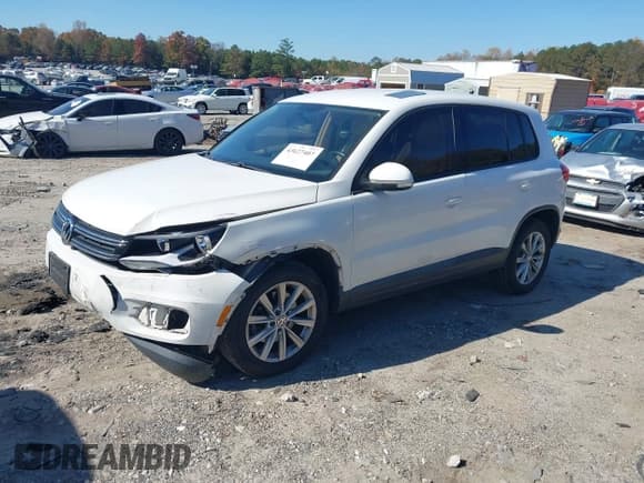 ✅ 2014 Volkswagen Tiguan S • VIN: WVGBV3AX1EW042765 • Лот: 43627407. Опубликован ранее на IAAI с пробегом 154 339 миль. Бесплатный доступ к архиву аукционных продаж из США и подробный отчёт об истории автомобиля на DreamBid. Изображение 2.