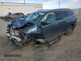 ✅ 2020 Honda Pilot Touring 8-Passenger • VIN: 5FNYF6H97LB001613 • Lot: 72004285. Wystawiony na Copart z przebiegiem Nie podano. Bezpłatny archiwum sprzedaży aukcyjnych z USA i szczegółowy raport historii pojazdu na DreamBid. Zdjęcie 1.