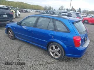 ✅ 2003 Mazda Protege • VIN: JM1BJ245931208271 • Lot: 43562632. Wystawiony na IAAI z przebiegiem 147 145 mil. Bezpłatny archiwum sprzedaży aukcyjnych z USA i szczegółowy raport historii pojazdu na DreamBid. Zdjęcie 3.