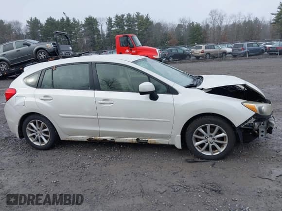✅ 2012 Subaru Impreza Premium • VIN: JF1GPAC61CH228262 • Lot: 43804230. Listed on IAAI with 131,568 mi. Free auction sales archive from the USA and detailed vehicle history report at DreamBid. Image 13.