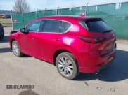 ✅ 2022 Mazda CX-5 Signature • VIN: JM3KFBXY6N0612457 • Lot: 41820607. Listed on IAAI with 51,486 mi. Free auction sales archive from the USA and detailed vehicle history report at DreamBid. Image 3.