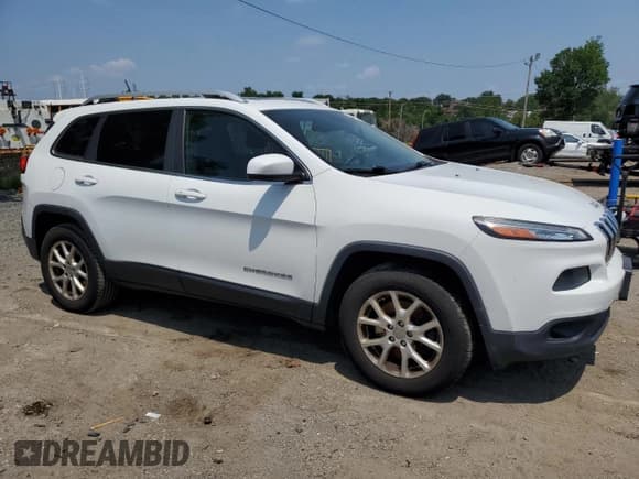 ✅ 2014 Jeep Cherokee Altitude • VIN: 1C4PJMCS5EW212252 • Lot: 64934565. Listed on Copart with 138,244 mi. Free auction sales archive from the USA and detailed vehicle history report at DreamBid. Image 4.