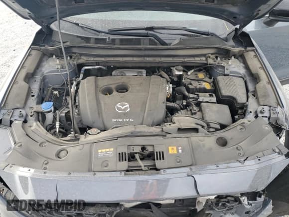 ✅ 2023 Mazda CX-5 S Carbon Edition • VIN: JM3KFBCM6P0140718 • Лот: 83949755. Опубликован ранее на Copart с пробегом 38 444 миль. Бесплатный доступ к архиву аукционных продаж из США и подробный отчёт об истории автомобиля на DreamBid. Изображение 12.