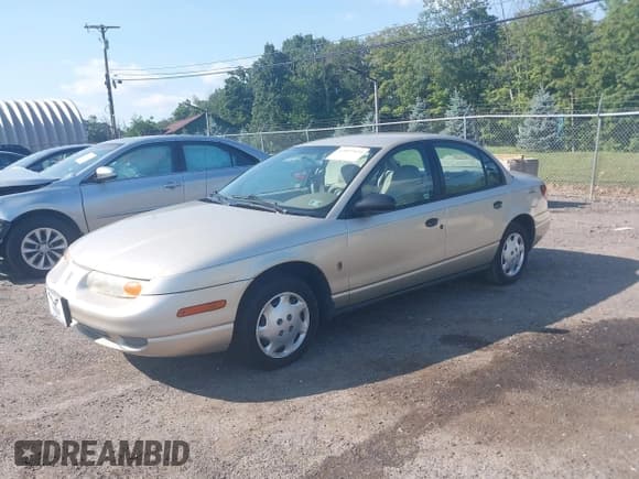 ✅ 2002 Saturn SL • VIN: 1G8ZH52812Z227514 • Lot: 42859934. Listed on IAAI with 84,221 mi. Free auction sales archive from the USA and detailed vehicle history report at DreamBid. Image 2.