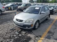 ✅ 2009 Kia Rio LX • VIN: KNADE243X96580822 • Lot: 42298525. Wystawiony na IAAI z przebiegiem 157 013 mil. Bezpłatny archiwum sprzedaży aukcyjnych z USA i szczegółowy raport historii pojazdu na DreamBid. Zdjęcie 2.