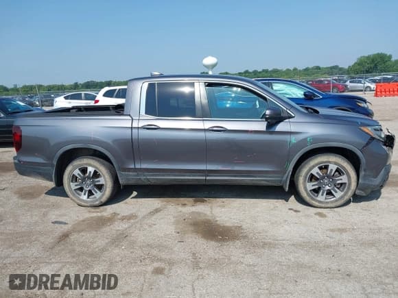 ✅ 2017 Honda Ridgeline RTL-T • VIN: 5FPYK3F68HB030670 • Lot: 42464963. Listed on IAAI with 142,612 mi. Free auction sales archive from the USA and detailed vehicle history report at DreamBid. Image 14.