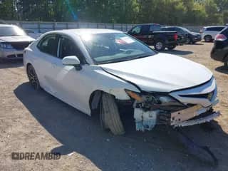 2023 Toyota Camry SE with VIN 4T1G11BK6PU100117, listed as a IAAI auction lot 43194290 with 54,061 mi miles and . Bid and sale history available at DreamBid. Image 1.