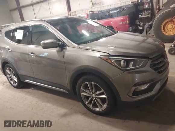 2017 Hyundai Santa Fe 2.0T z VIN 5XYZUDLA4HG424259, wystawiony jako IAAI lot #42657783 z przebiegiem 213 040 mil mil oraz . Historia ofert i sprzedaży dostępna na DreamBid. Obrazek 13.