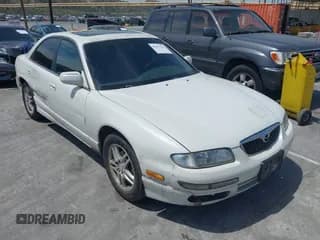 ✅ 1999 Mazda Millenia • VIN: JM1TA221XX1501221 • Lot: 42237562. Wystawiony na IAAI z przebiegiem 158 048 mil. Bezpłatny archiwum sprzedaży aukcyjnych z USA i szczegółowy raport historii pojazdu na DreamBid. Zdjęcie 1.