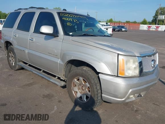 ✅ 2004 Cadillac Escalade • VIN: 1GYEK63N14R200973 • Lot: 42926800. Listed on IAAI with 261,068 mi. Free auction sales archive from the USA and detailed vehicle history report at DreamBid. Image 1.