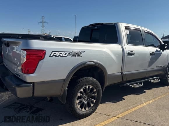 ✅ 2019 Nissan Titan Pro-4X • VIN: 1N6AA1F43KN515529 • Lot: 77988254. Listed on Copart with 114,979 mi. Free auction sales archive from the USA and detailed vehicle history report at DreamBid. Image 4.