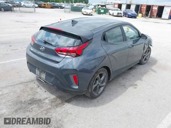 2019 Hyundai Veloster Premium z VIN KMHTG6AF2KU016593, wystawiony jako IAAI lot #42310151 z przebiegiem Nie podano mil oraz . Historia ofert i sprzedaży dostępna na DreamBid. Obrazek 4.