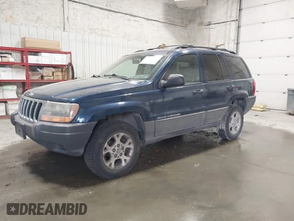 ✅ 1999 Jeep Grand Cherokee Laredo • VIN: 1J4GW58S1XC779363 • Лот: 42492609. Опубликован ранее на IAAI с пробегом 168 820 миль. Бесплатный доступ к архиву аукционных продаж из США и подробный отчёт об истории автомобиля на DreamBid. Изображение 2.