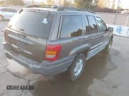 ✅ 1999 Jeep Grand Cherokee Laredo • VIN: 1J4G258S3XC560920 • Lot: 43885427. Listed on IAAI with 176,308 mi. Free auction sales archive from the USA and detailed vehicle history report at DreamBid. Image 4.