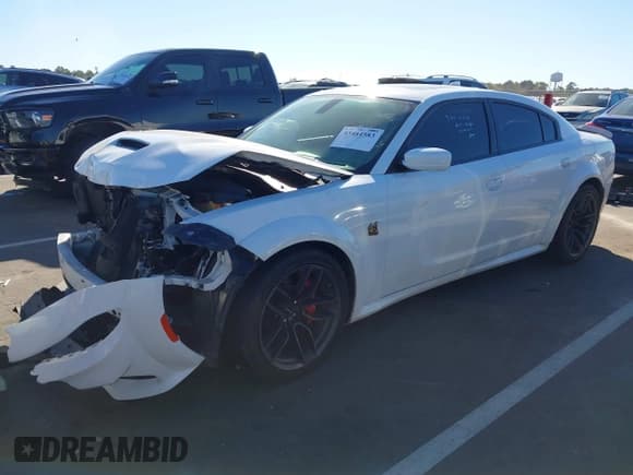 ✅ 2021 Dodge Charger Scat Pack Widebody • VIN: 2C3CDXGJ4MH615309 • Lot: 43484583. Listed on IAAI with 56,228 mi. Free auction sales archive from the USA and detailed vehicle history report at DreamBid. Image 2.