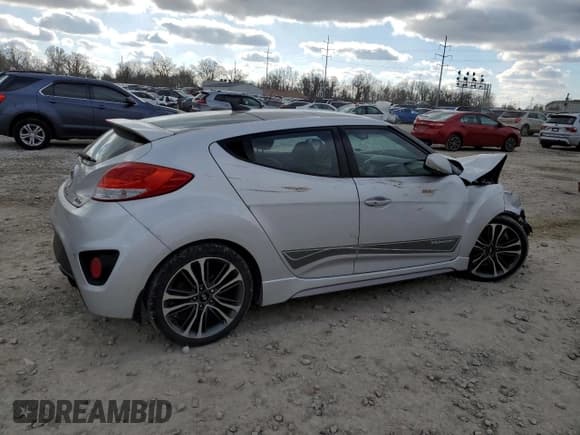 ✅ 2016 Hyundai Veloster Turbo • VIN: KMHTC6AE5GU275735 • Lot: 82707824. Listed on Copart with 105,870 mi. Free auction sales archive from the USA and detailed vehicle history report at DreamBid. Image 3.
