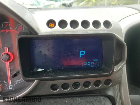 2012 Chevrolet Sonic LT z VIN 1G1JC5SB0C4187463, wystawiony jako Copart lot #68758074 z przebiegiem 123 060 mil mil oraz Szkoda całkowita • Salvage title. Historia ofert i sprzedaży dostępna na DreamBid. Obrazek 9.