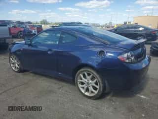 ✅ 2007 Hyundai Tiburon GT • VIN: KMHHN66F97U256039 • Лот: 82313705. Опубликован ранее на Copart с пробегом 151 935 миль. Бесплатный доступ к архиву аукционных продаж из США и подробный отчёт об истории автомобиля на DreamBid. Изображение 2.