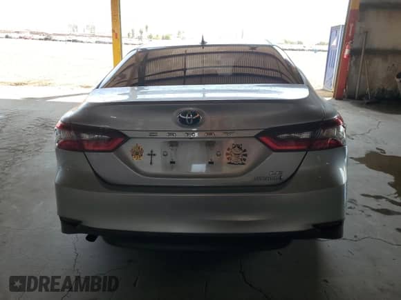 2021 Toyota Camry Hybrid LE with VIN 4T1C31AK5MU554381, listed as a Copart auction lot 69998775 with 104,313 mi miles and Salvage title. Bid and sale history available at DreamBid. Image 6.