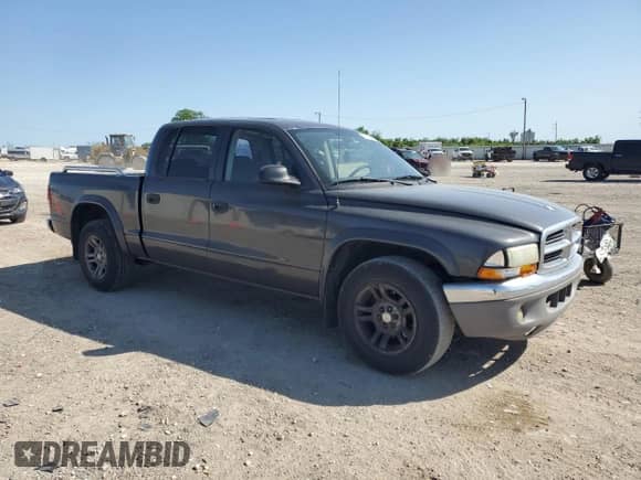 2003 Dodge Dakota SLT z VIN 1D7HL48X03S114761, wystawiony jako Copart lot #52323405 z przebiegiem 137 105 mil mil oraz Szkoda całkowita • Salvage title. Historia ofert i sprzedaży dostępna na DreamBid. Obrazek 4.