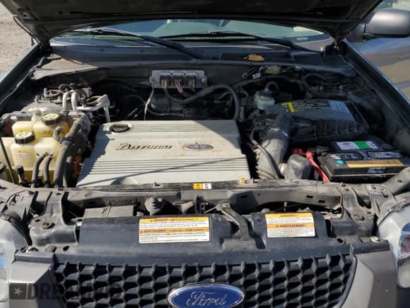 ✅ 2006 Ford Escape Hybrid • VIN: 1FMCU96H26KC28349 • Lot: 84256835. Wystawiony na Copart z przebiegiem 185 083 mil. Bezpłatny archiwum sprzedaży aukcyjnych z USA i szczegółowy raport historii pojazdu na DreamBid. Zdjęcie 12.