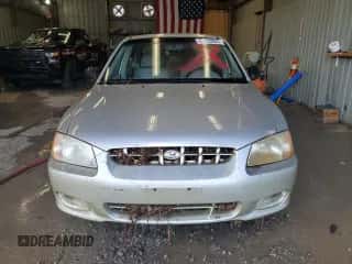 2002 Hyundai Accent GL z VIN KMHCG45C32U373009, wystawiony jako Copart lot #62753865 z przebiegiem Nie podano mil oraz Szkoda całkowita • Salvage title. Historia ofert i sprzedaży dostępna na DreamBid. Obrazek 5.