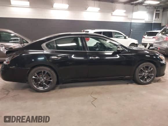 2012 Nissan Maxima S z VIN 1N4AA5AP9CC863172, wystawiony jako IAAI lot #42120073 z przebiegiem 102 500 mil mil oraz . Historia ofert i sprzedaży dostępna na DreamBid. Obrazek 13.