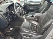 ✅ 2013 Volkswagen Touareg Sport • VIN: WVGEF9BP5DD005840 • Lot: 94148955. Listed on Copart with 148,901 mi. Free auction sales archive from the USA and detailed vehicle history report at DreamBid. Image 7.