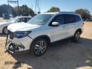✅ 2017 Honda Pilot Touring • VIN: 5FNYF5H97HB039487 • Lot: 90976975. Wystawiony na Copart z przebiegiem 92 301 mil. Bezpłatny archiwum sprzedaży aukcyjnych z USA i szczegółowy raport historii pojazdu na DreamBid. Zdjęcie 1.