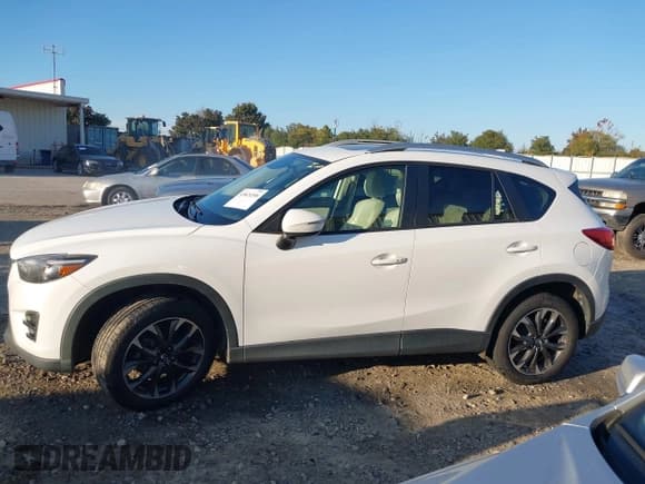 ✅ 2016 Mazda CX-5 Grand Touring • VIN: JM3KE2DYXG0796487 • Lot: 43624306. Wystawiony na IAAI z przebiegiem 233 746 mil. Bezpłatny archiwum sprzedaży aukcyjnych z USA i szczegółowy raport historii pojazdu na DreamBid. Zdjęcie 14.