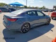 ✅ 2025 Nissan Sentra SV • VIN: 3N1AB8CV5SY328434 • Лот: 85149585. Опубликован ранее на Copart с пробегом 5 425 миль. Бесплатный доступ к архиву аукционных продаж из США и подробный отчёт об истории автомобиля на DreamBid. Изображение 3.