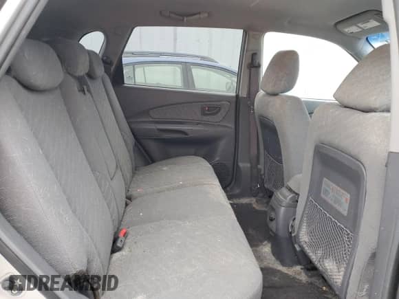 2005 Hyundai Tucson GL z VIN KM8JM12B75U146582, wystawiony jako Copart lot #82966094 z przebiegiem 132 445 mil mil oraz Nie do naprawy • Non repairable. Historia ofert i sprzedaży dostępna na DreamBid. Obrazek 11.