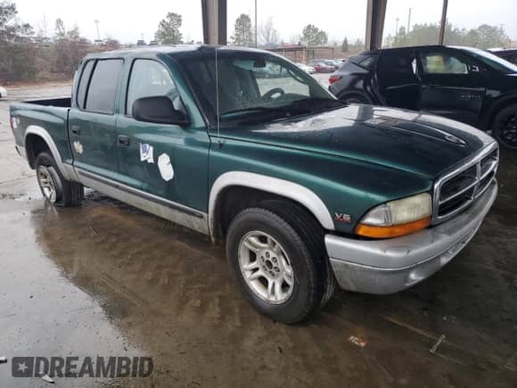 2003 Dodge Dakota SLT z VIN 1D7HL48X03S261436, wystawiony jako Copart lot #42317965 z przebiegiem 136 380 mil mil oraz Szkoda całkowita • Salvage title. Historia ofert i sprzedaży dostępna na DreamBid. Obrazek 4.